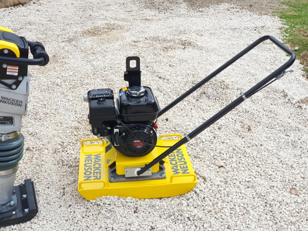 Compacter preparing the Ground Surface for a Container